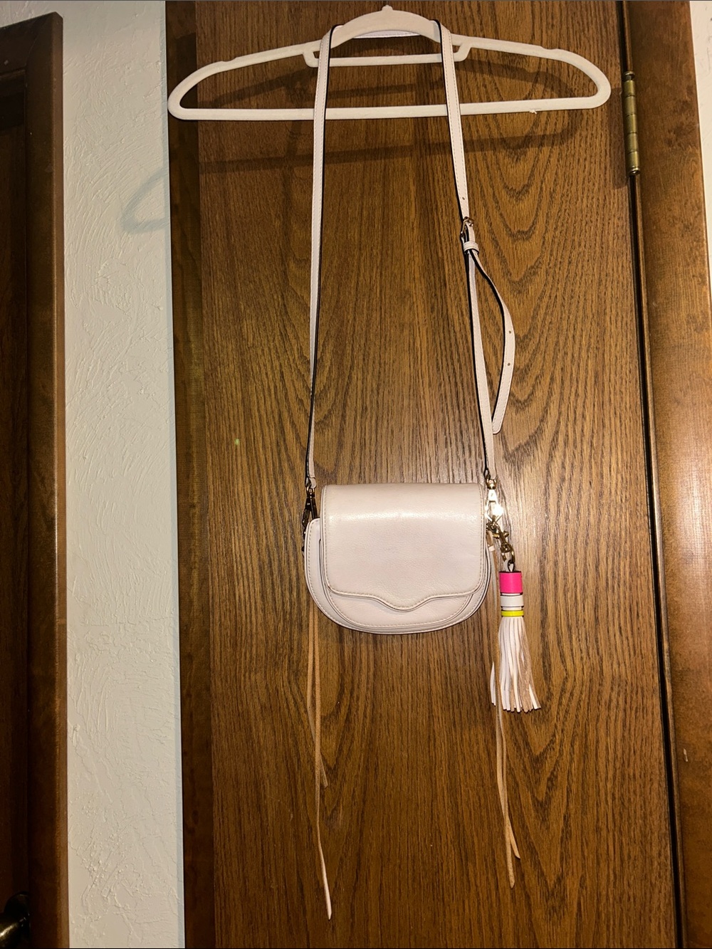 Cream Crossbody Saddle Bag with Tassel Accent